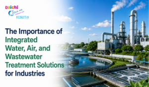 Industrial water and air treatment plant with circular tanks and tall processing towers under a blue sky.