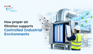 Worker in a high-visibility vest services industrial air filters as airflow, leaves, and particles illustrate controlled air filtration.