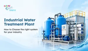 Industrial water treatment plant with blue filtration tanks, pipes, pumps, and control equipment for industrial water treatment.